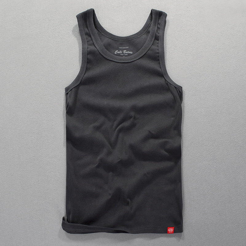 Dark gray men's tank top laid flat showcasing the neckline and stitching