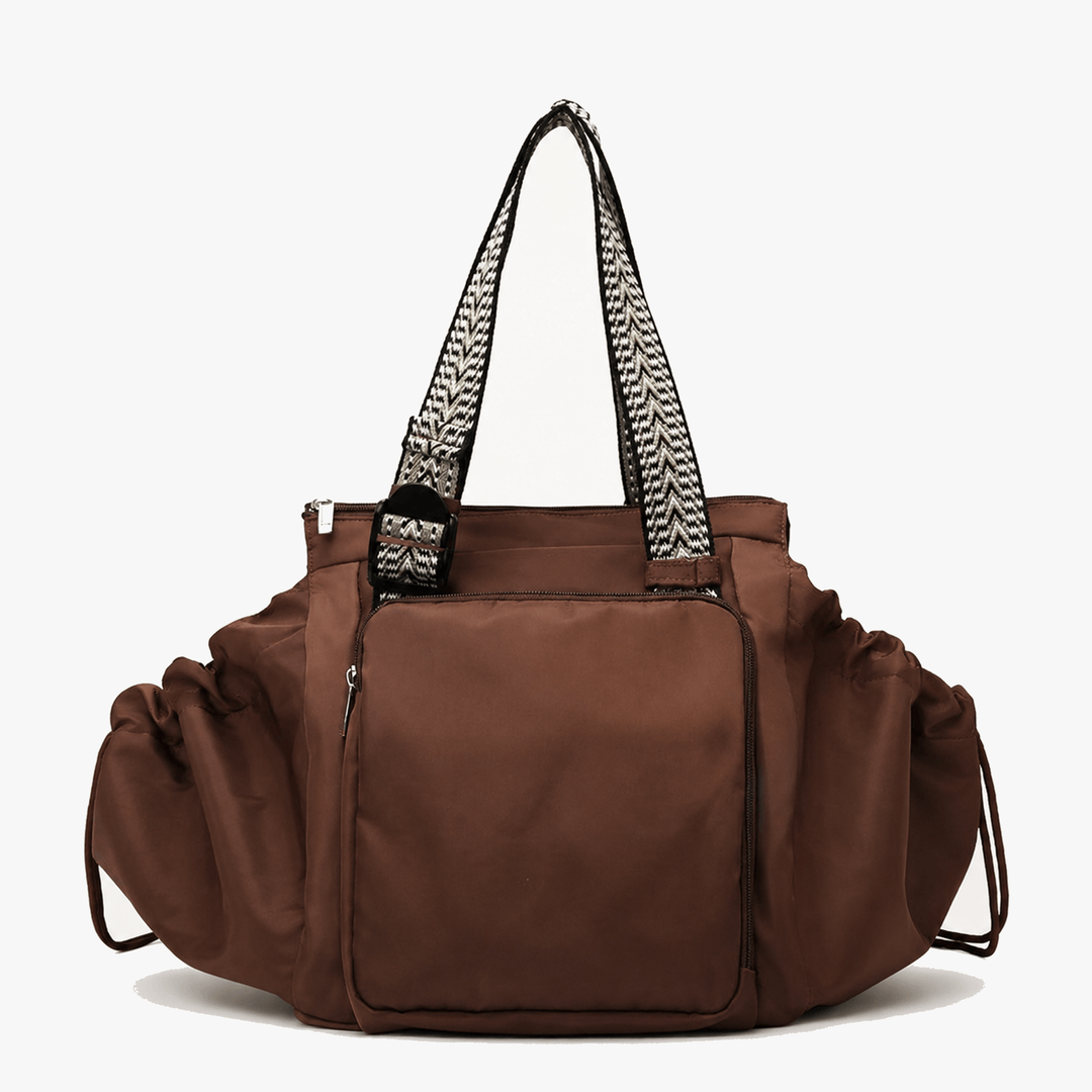 Brown convertible everyday tote and backpack with multiple compartments