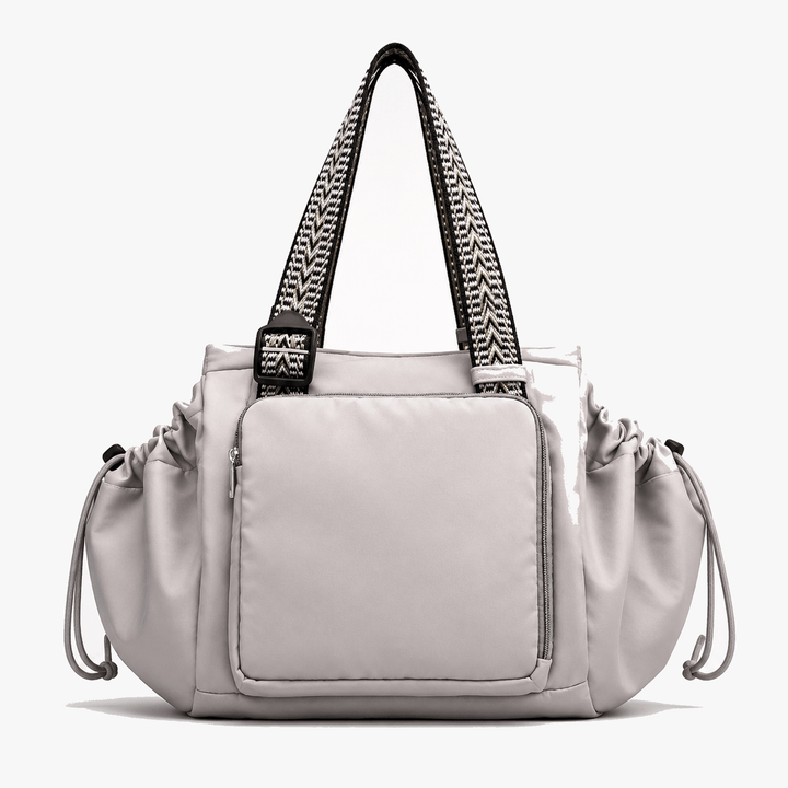 Women's convertible everyday tote and backpack showing secure zipper closure