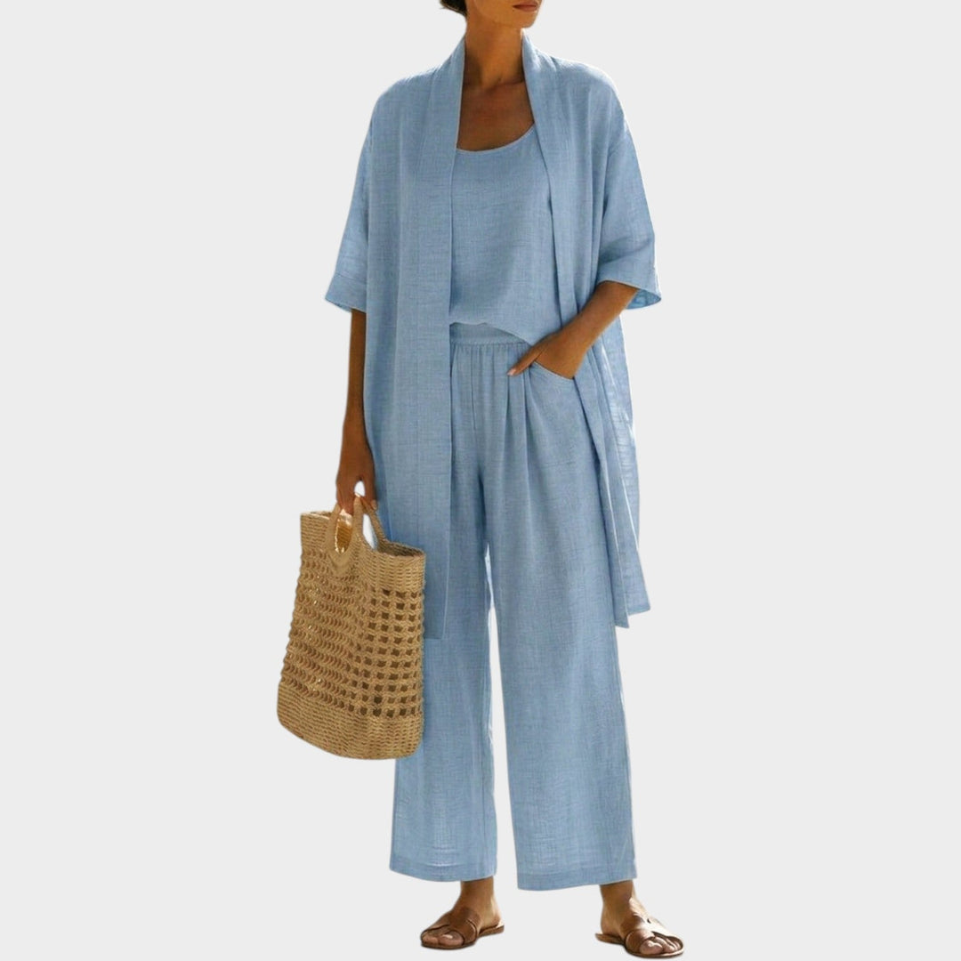 Woman wearing light blue casual three-piece outfit set