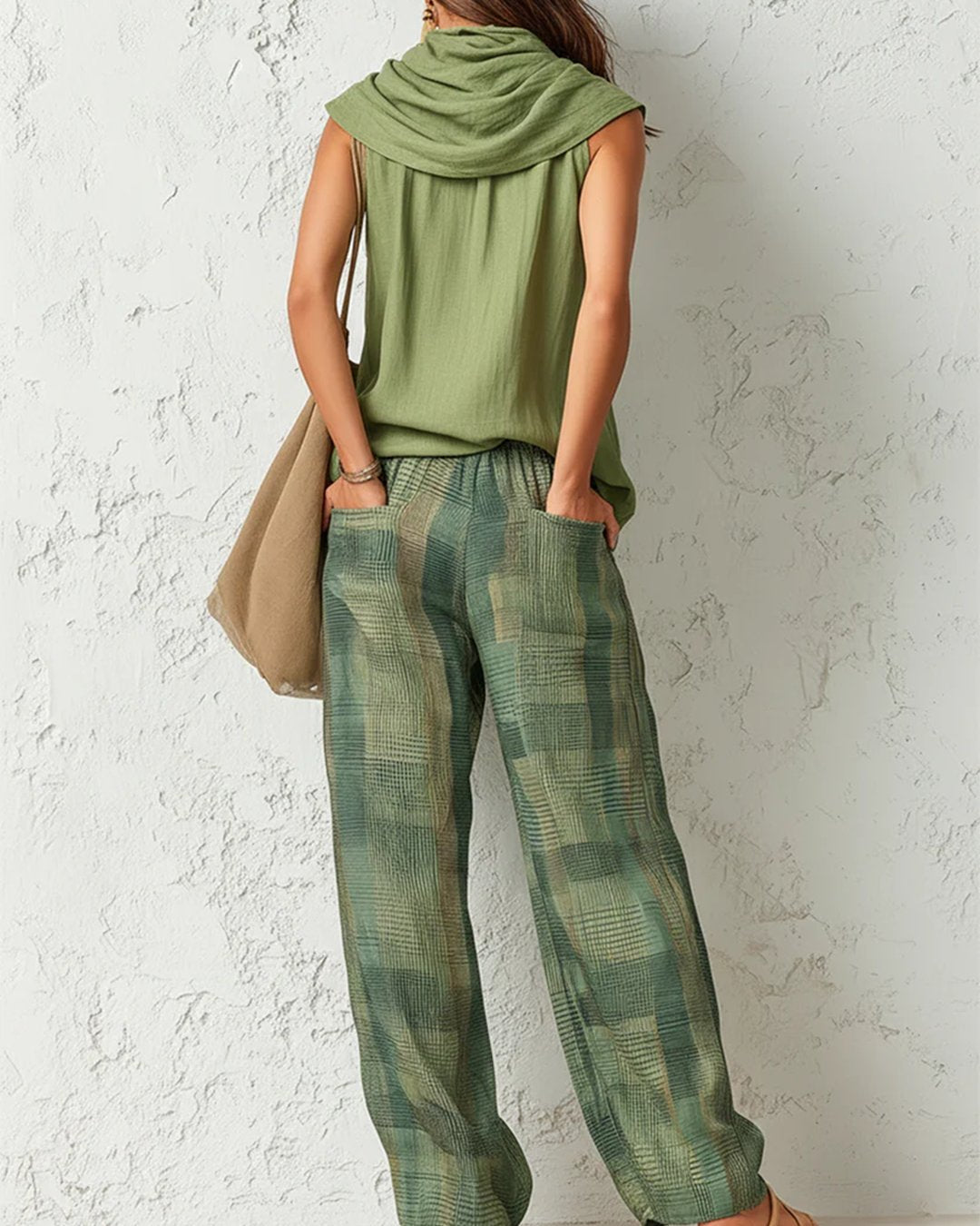 Back view of a woman showcasing the relaxed fit of the botanica matching set and trousers with pockets.
