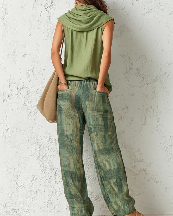 Back view of a woman showcasing the relaxed fit of the botanica matching set and trousers with pockets.