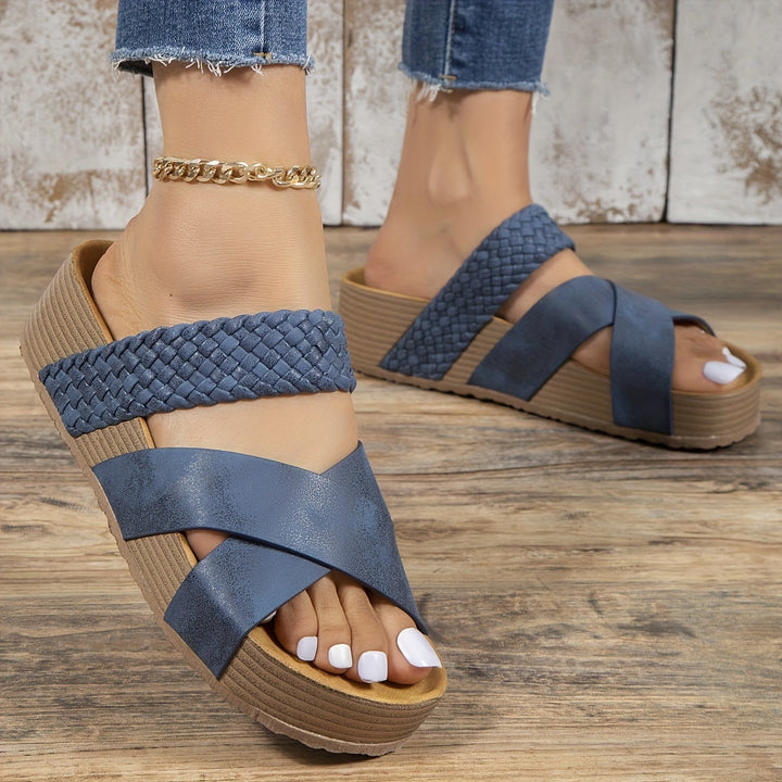 Blue women's orthopedic woven platform sandal worn with jeans