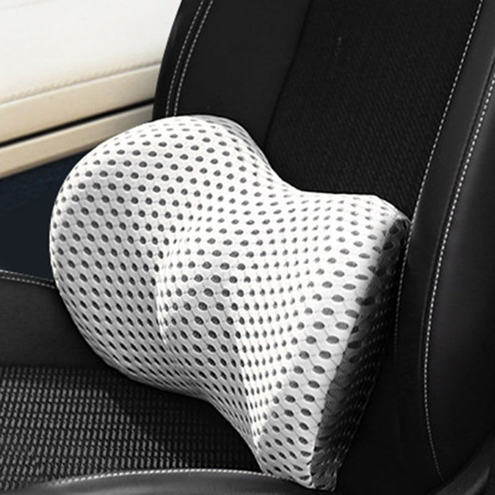 Ergonomic orthopaedic lumbar support cushion placed on an office chair for back pain relief