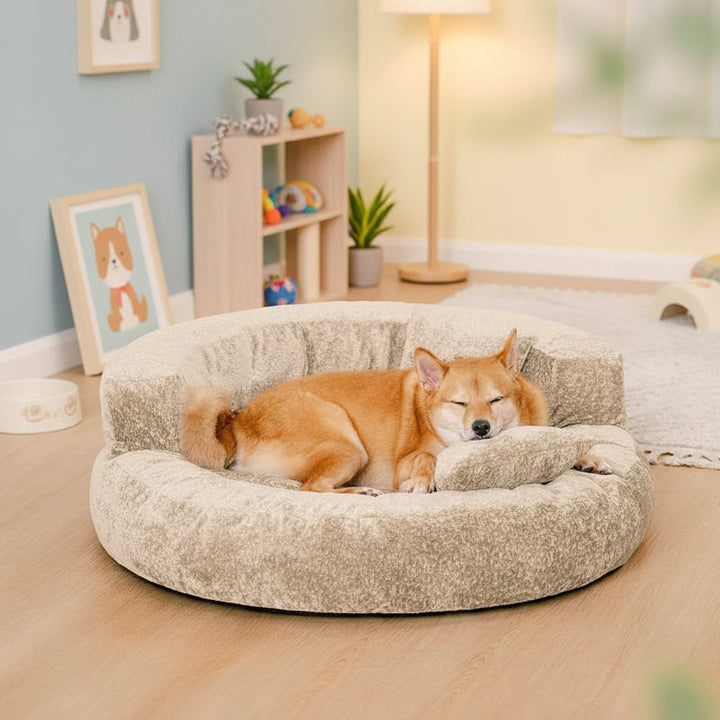 Beige orthopedic donut dog bed featuring elevated side cushions and an included pillow