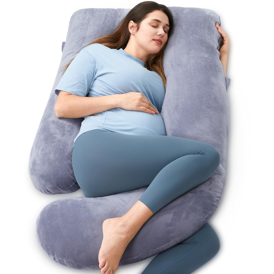 Pregnant woman sleeping comfortably with a full-body support pillow in black