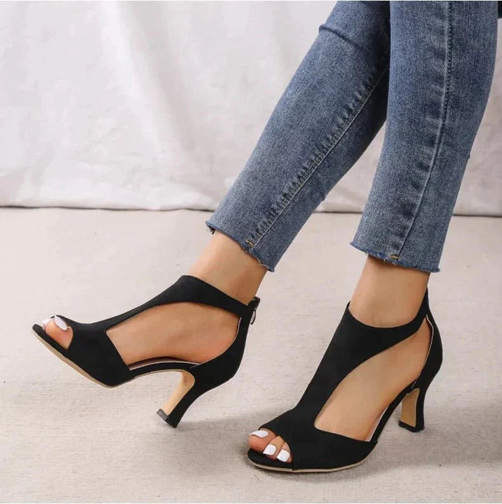 Bottom outsole and sturdy block heel view of orthopedic t-strap sandals