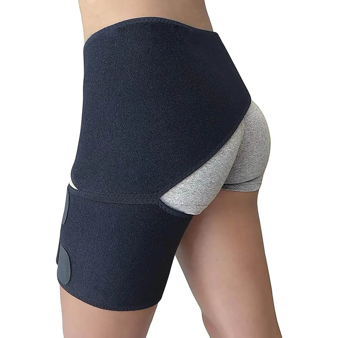 Person wearing a black orthopedic hip stabilizer wrap for joint support