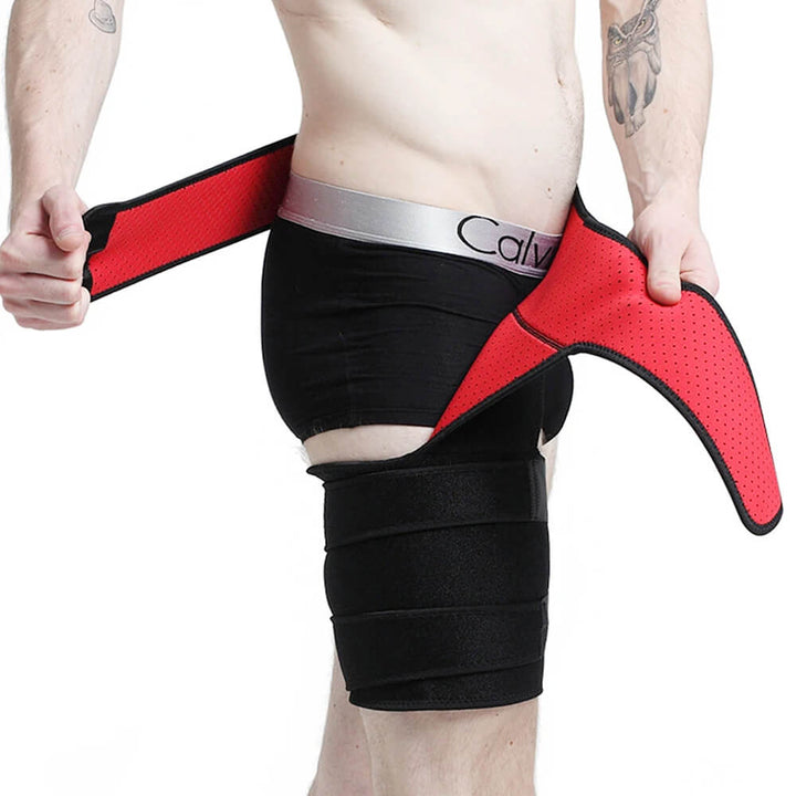 Close-up of a red and black hip stabilizer brace being adjusted