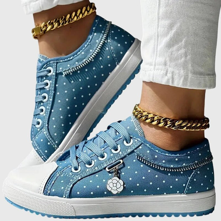 Pair of women's orthopedic sneakers with wide toe box and flexible design