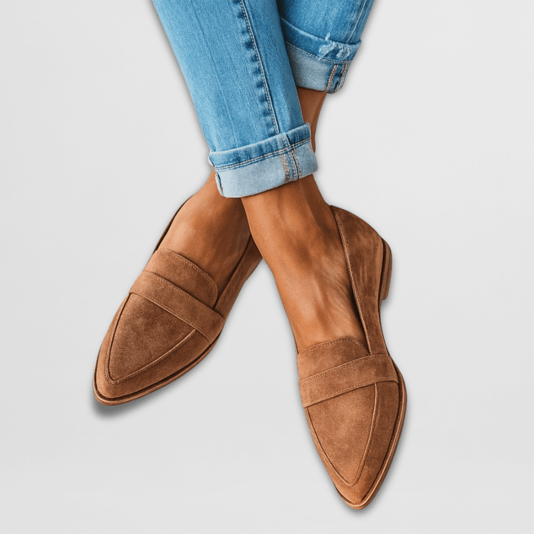 Brown slip-on loafers styled with rolled-up denim jeans