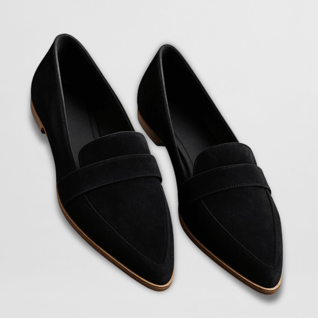 Black slip-on loafers displayed cleanly on a neutral background