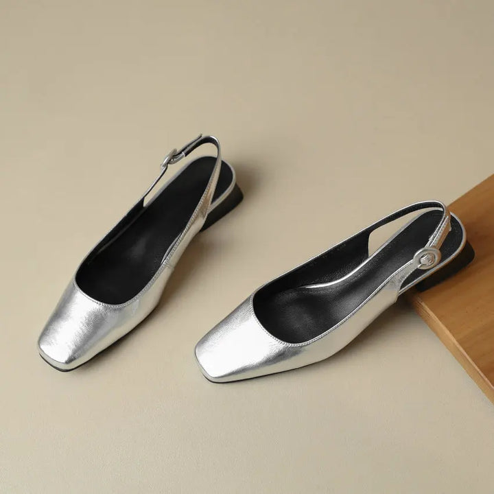 Pair of stylish red orthopaedic shoes with adjustable slingback strap