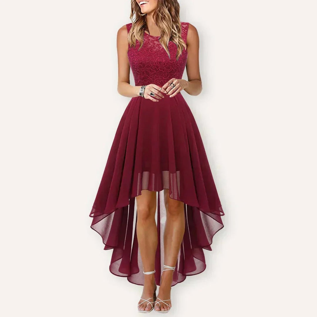 Studio shot of woman wearing elegant sleeveless formal dress