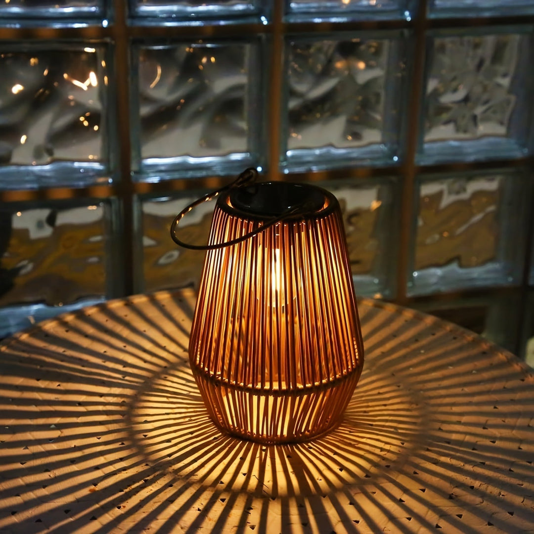 Close-up of a single solar woven lantern casting light patterns on a table