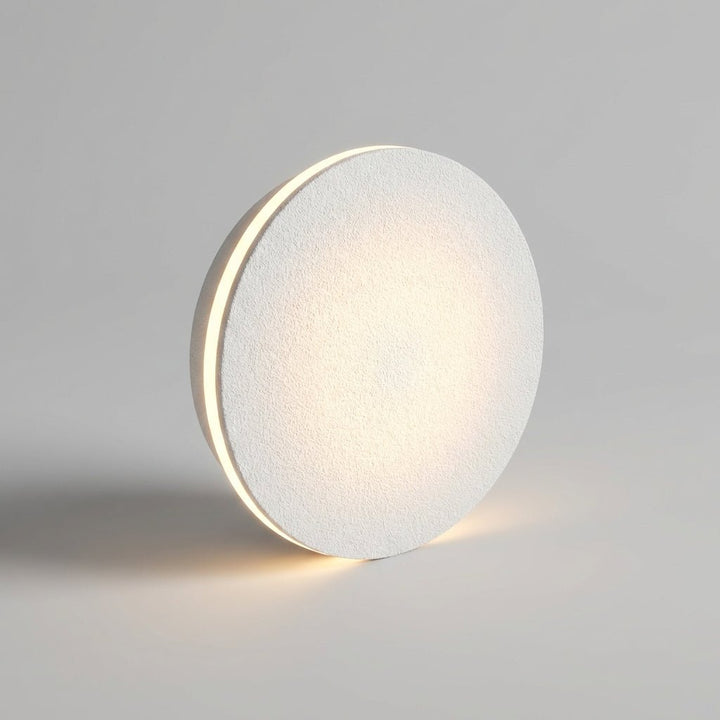 Energy-efficient LED wall light casting a dramatic up and down beam pattern outdoors.