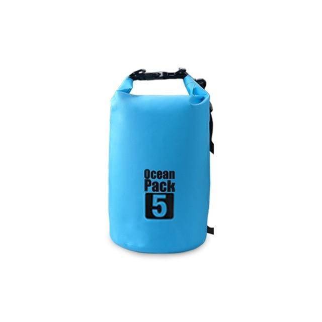 Blue waterproof dry bag with roll-top closure and Ocean Pack logo