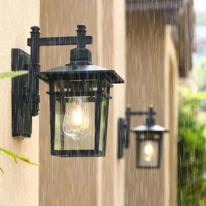 Garden light fixture casting warm illumination on patio wall