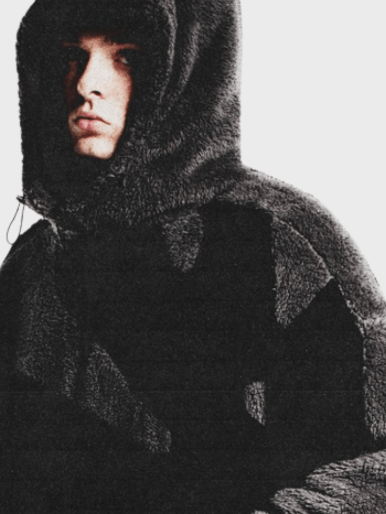 Close up fabric detail of mens casual hooded jacket with zipper closure