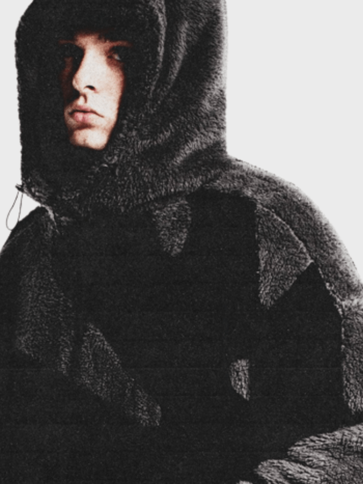 Close up fabric detail of mens casual hooded jacket with zipper closure
