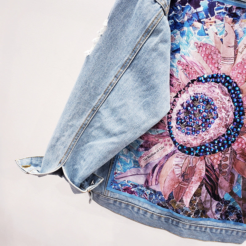 Detailed view of sleeve cuff and hem texture on the denim jacket