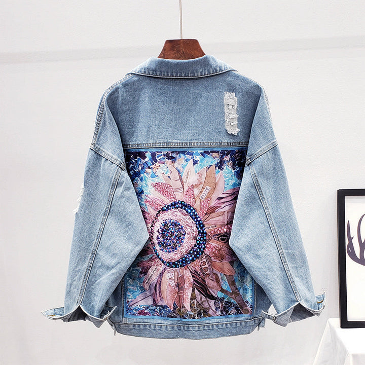 Back view of women's oversized denim jacket with floral graphic print