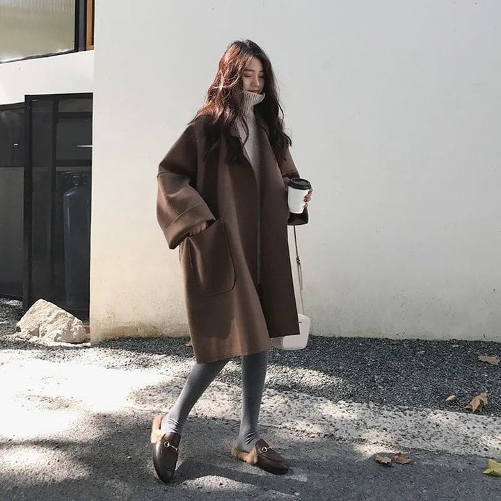 Full view of the stylish women's oversized trench coat in warm coffee tone