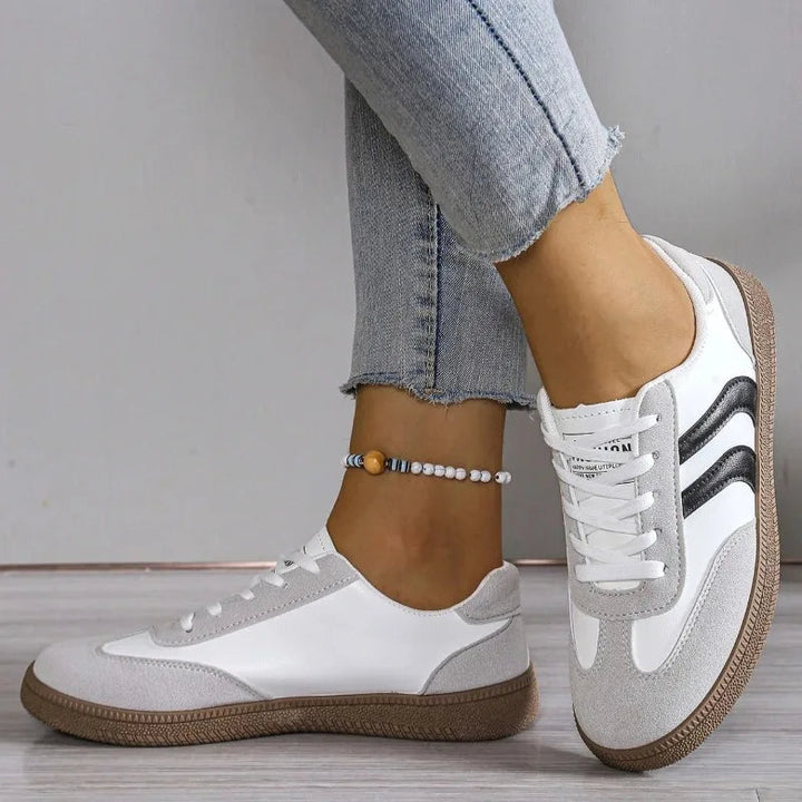 Close-up of lace-up closure and breathable mesh on comfortable walking shoes