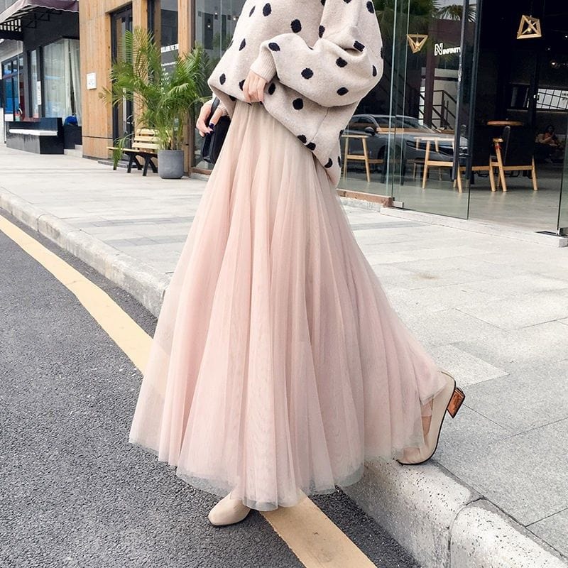Side view of womens flowy layered maxi skirt in solid color