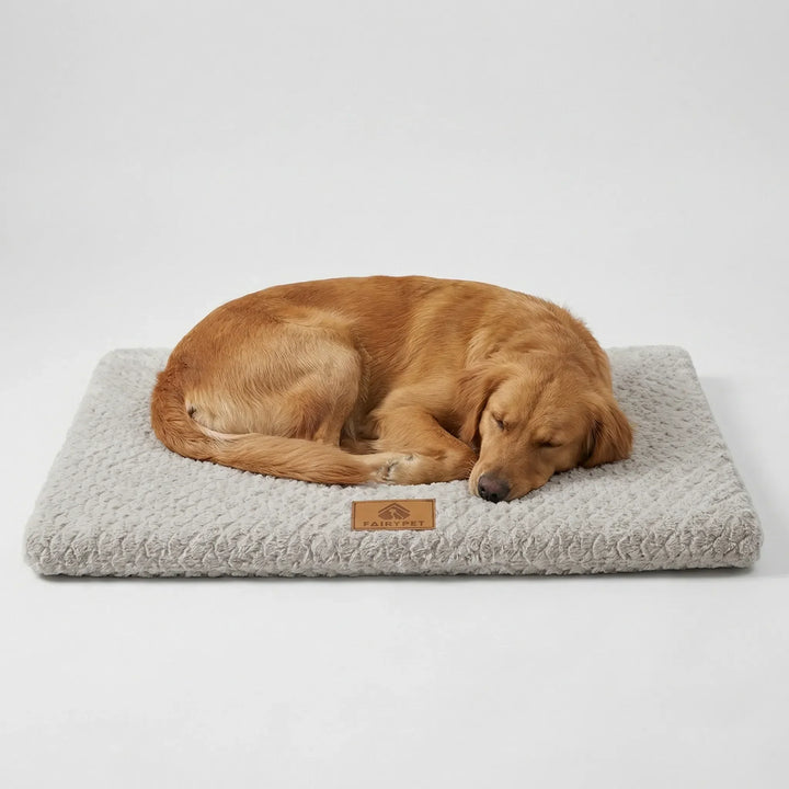 Golden retriever relaxing on a light gray supportive flat dog bed mat