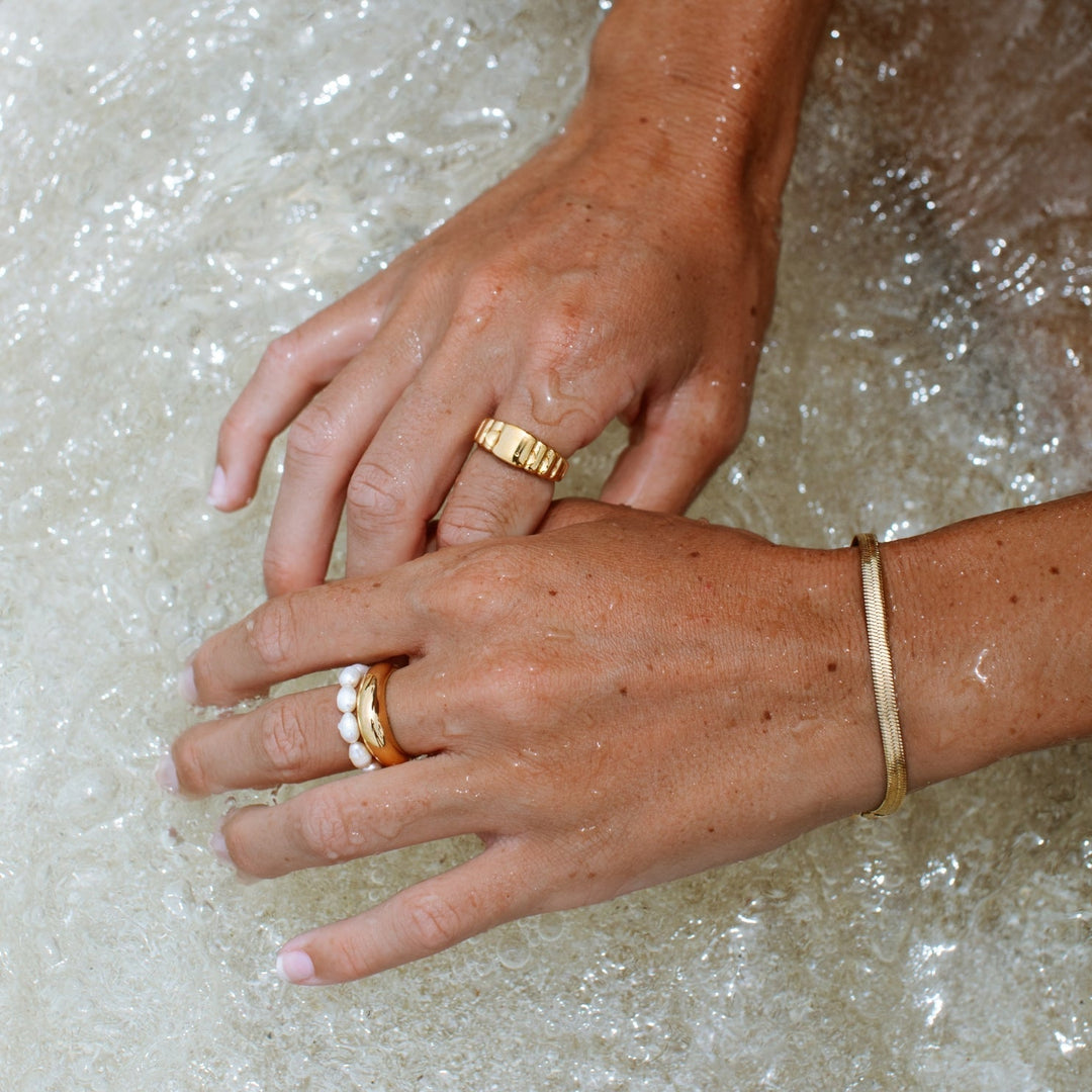 Close-up of the elegant pearl ring showcasing ocean-inspired women jewelry