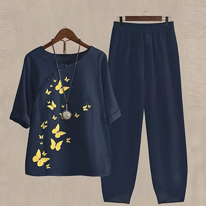 Women's floral two piece set featuring a relaxed fit blouse and matching pants