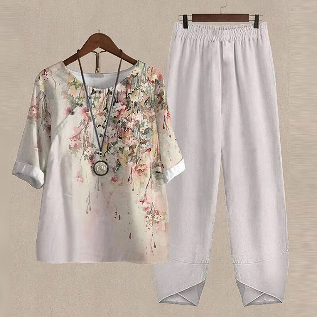 Stylish women's casual wear ensemble with a vibrant floral pattern on the blouse