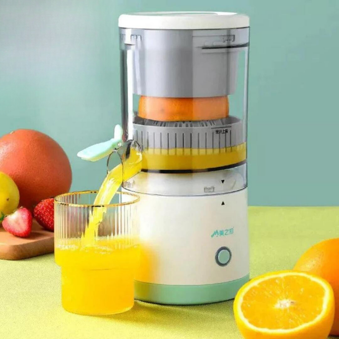 Cordless citrus juicer pouring fresh orange juice into a glass