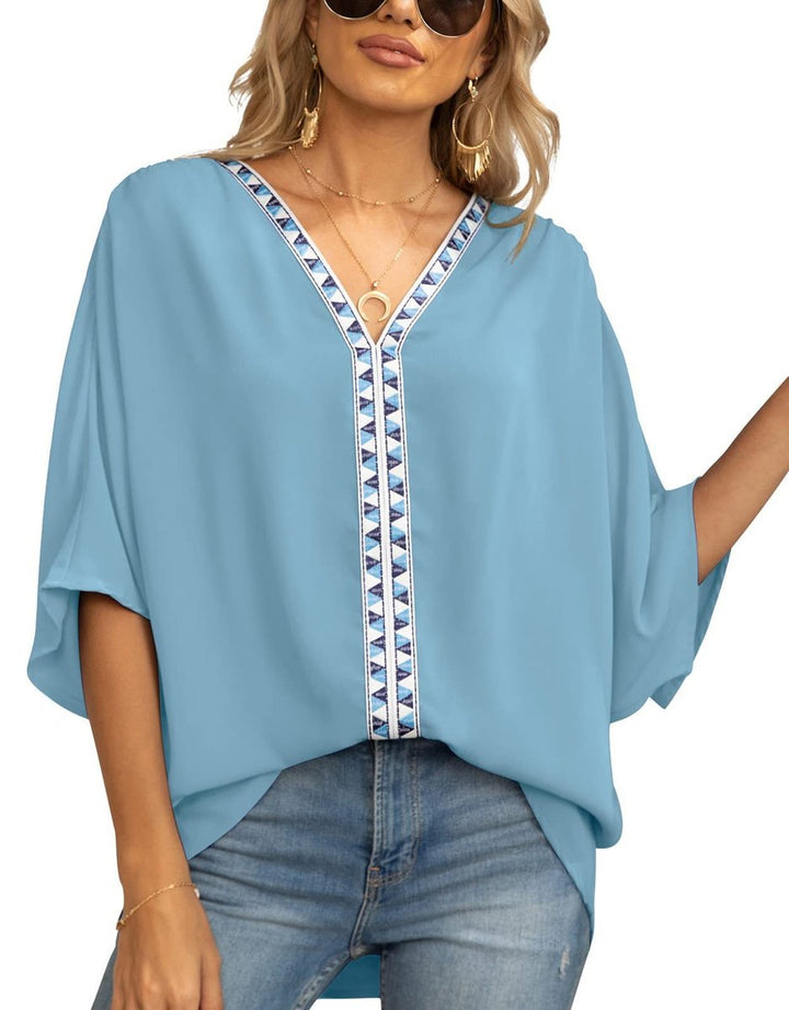 Plus size friendly women's tunic top showing the back drape and fabric texture