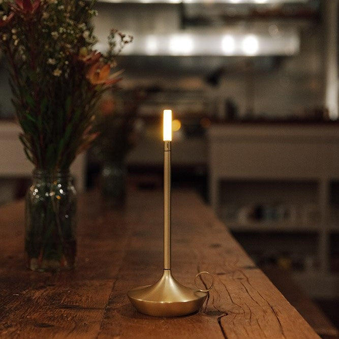 Rechargeable ambient bedside lamp featuring touch dimming controls