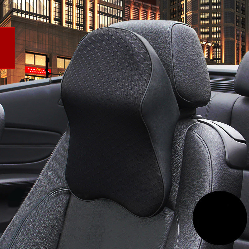 Black ergonomic car neck pillow installed on vehicle headrest