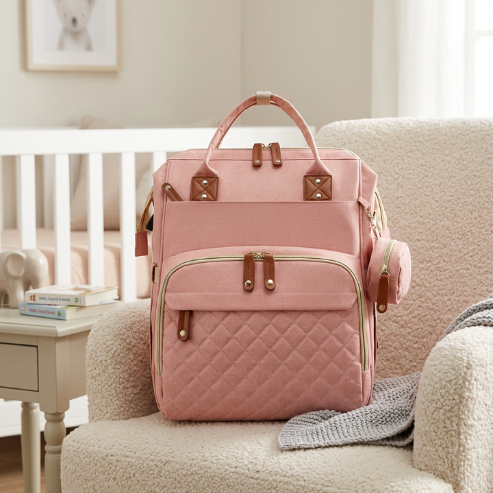 Baby gear backpack hanging on stroller handle using integrated straps