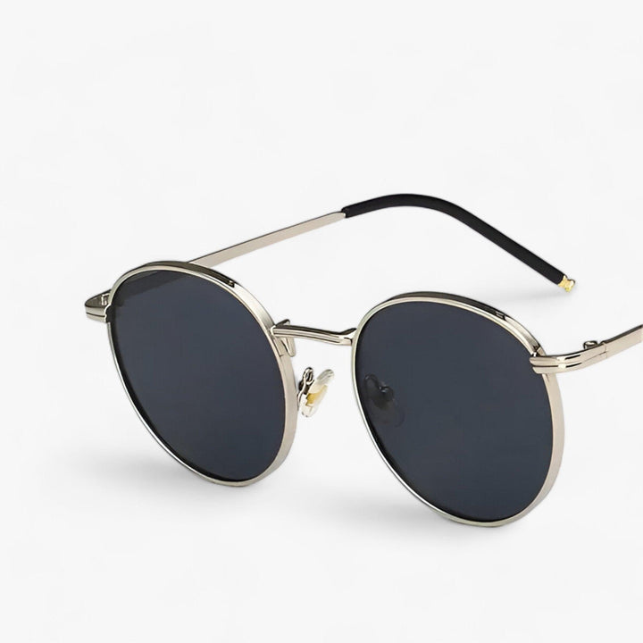 Close-up view of round designer sunglasses Nova for men and women