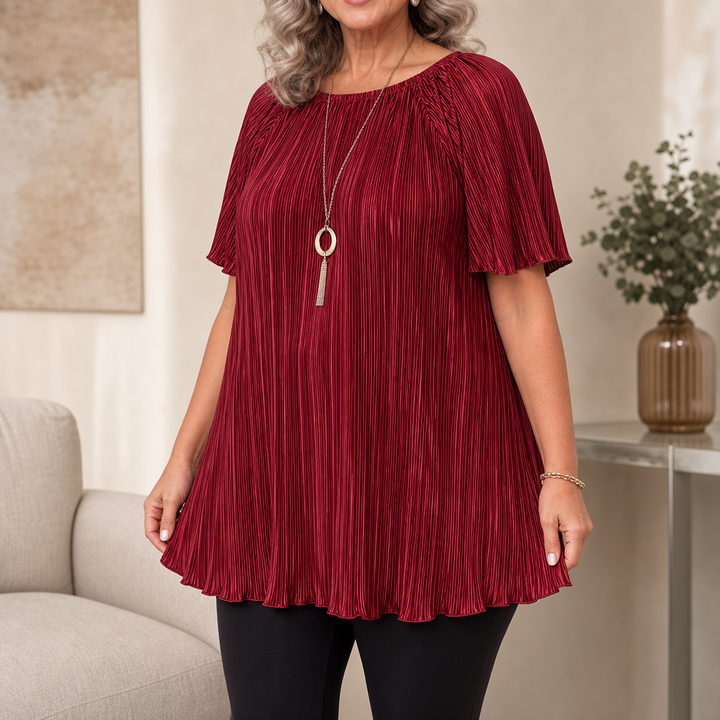 Black wide-fit blouse featuring elegant pleats and breathable short sleeves