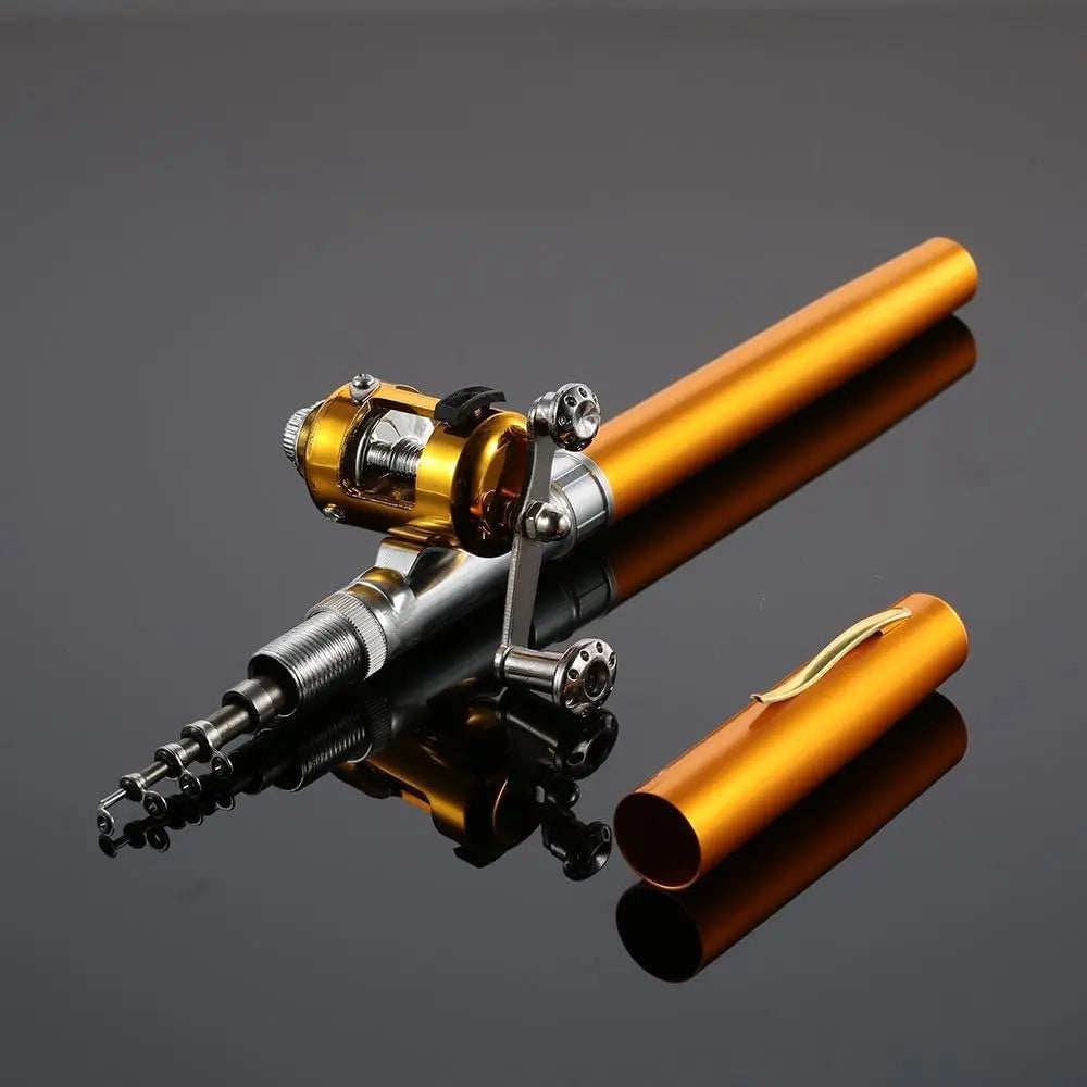 Gold compact pocket-sized fishing rod with open aluminum case and attached reel on a reflective surface