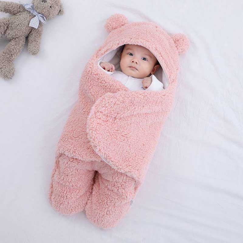 Baby sleeping bag pram accessory in soft pink with hood