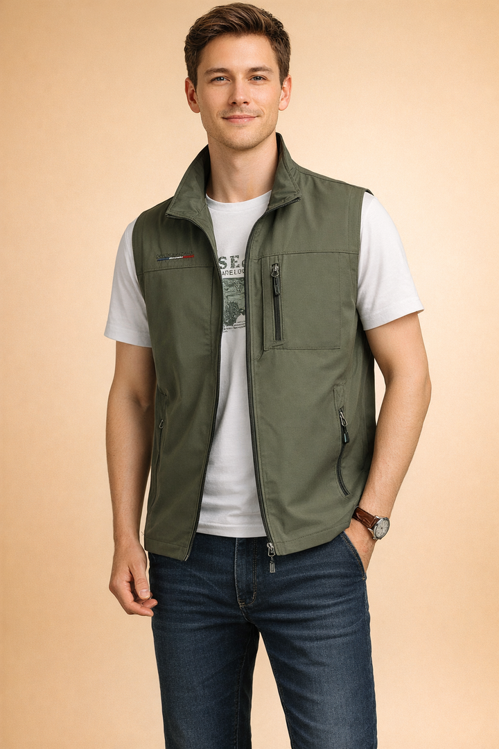 Model wearing green utility vest in studio setting