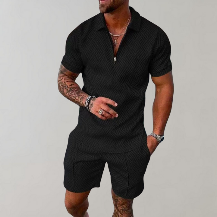 Man wearing black textured short-sleeve polo and matching shorts summer outfit