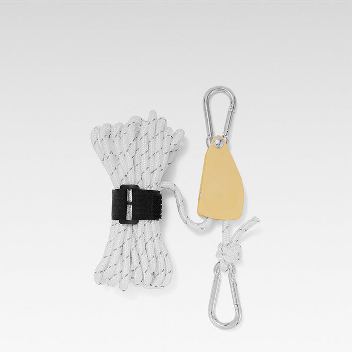 Close-up view of white reflective utility cord and tensioner