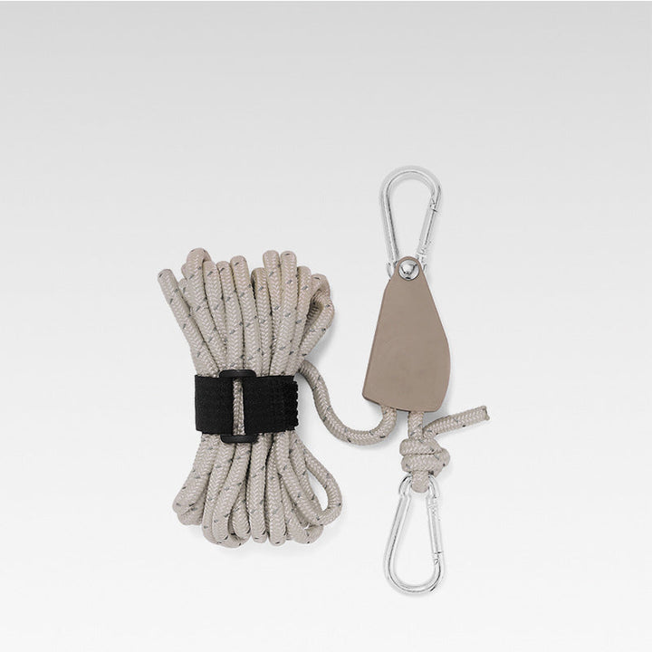 Reflective utility cord coiled neatly as essential hiking accessory