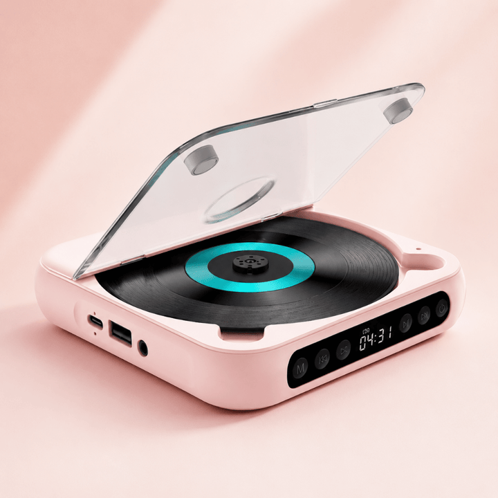 Pink portable Bluetooth CD player presented on soft pink background