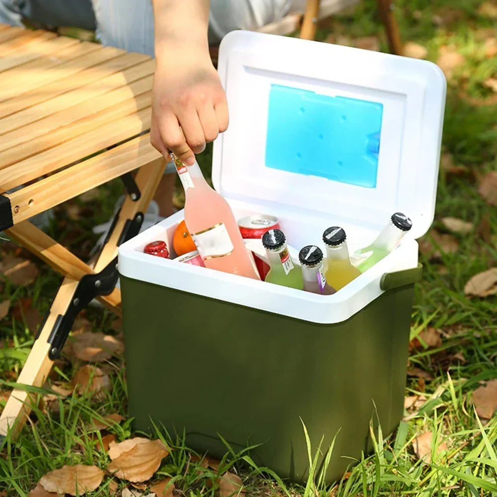 Open cooler box filled with drinks during an outdoor picnic
