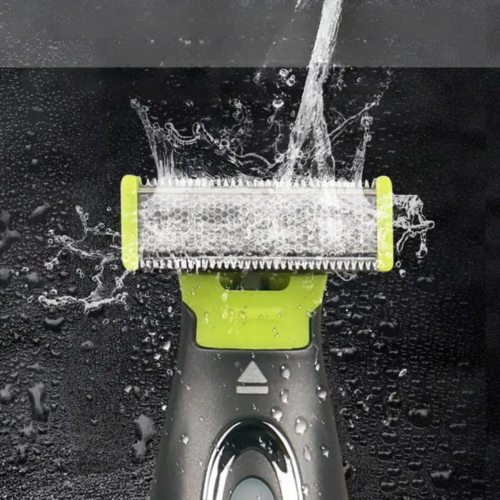 Close-up of the stainless steel T-shaped razor head being rinsed under a stream of water