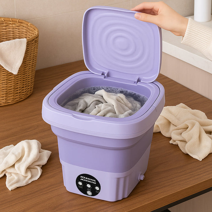 Open purple portable washing machine filled with water and laundry